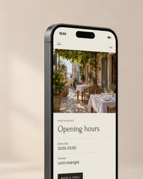 A hotel website on a phone, open at the restaurant’s summer hours.